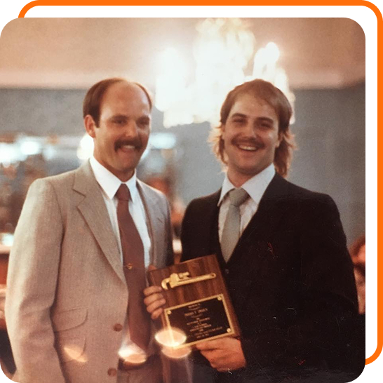 Historical photo of Horn Plumbing receiving award