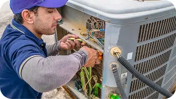 Technician working on an HVAC unit