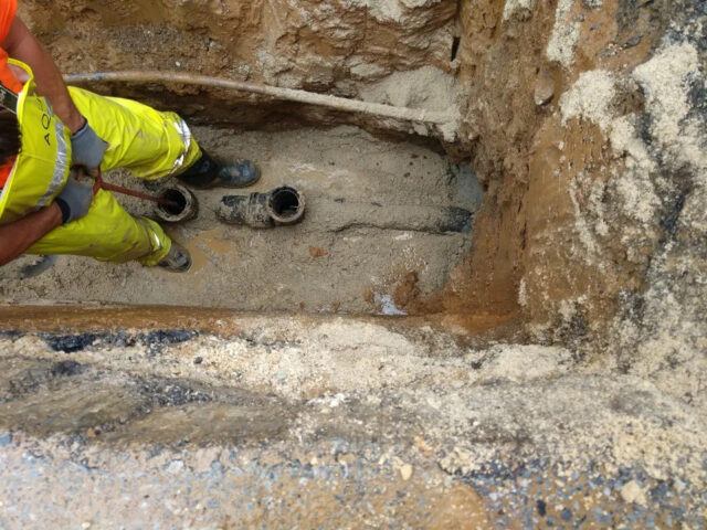 The piping is fortified with stone and concrete sewer trap replacement 02 1